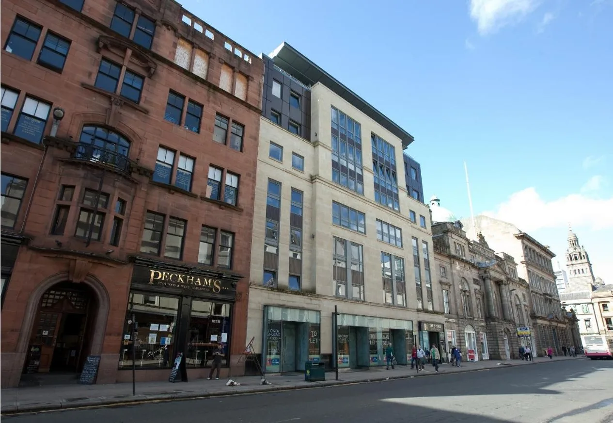 a group of buildings on a city street at The Spires Serviced Apartments Glasgow in Glasgow